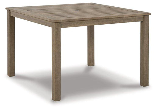 Outdoor dining table from Ashley Furniture's Aria Plains collection, featuring a sturdy wooden surface and modern design.