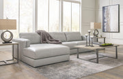 Ashley Furniture Amiata sectional with chaise, showing a modern fabric sofa with a spacious chaise lounge in a stylish living room.