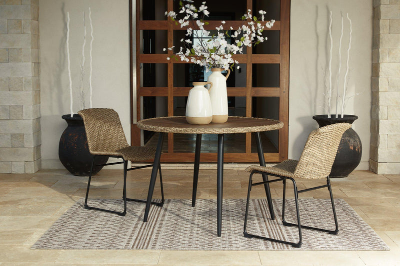 Outdoor dining set by Ashley Furniture featuring a table and chairs, perfect for outdoor meals and gatherings.