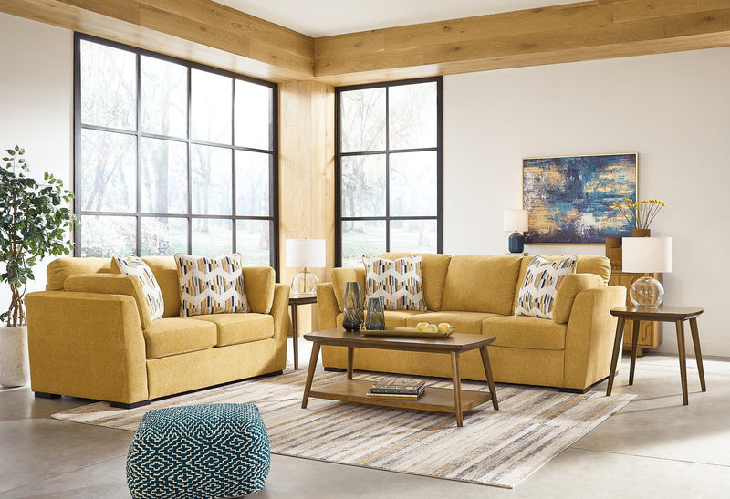 Ashley Furniture Keerwick living room set with sofa and armchair, featuring neutral upholstery and modern design.