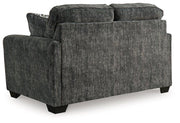 Ashley Furniture Lonoke living room set with plush sofa and matching armchair in a modern design, perfect for cozy living spaces.
