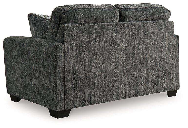 Ashley Furniture Lonoke living room set with plush sofa and matching armchair in a modern design, perfect for cozy living spaces.