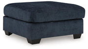 Ashley Furniture Aviemore oversized accent ottoman with plush fabric and sturdy wooden legs, ideal for living room decor.