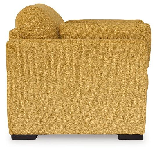 Ashley Furniture Keerwick living room set with sofa and armchair in a modern design, showcasing plush upholstery and stylish accents.