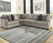 Ashley Furniture Bovarian living room set with beige fabric sofa and armchair, modern design, and wooden accents.