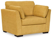 Ashley Furniture Keerwick living room set with sofa and armchair, featuring neutral fabric and modern design for comfortable lounging.