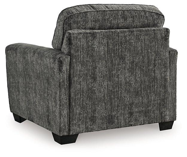 Ashley Furniture Lonoke Living Room Set with sofa and loveseat in a modern design, featuring neutral upholstery and wooden legs.
