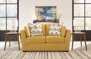 Ashley Furniture Keerwick living room set with sofa and loveseat, featuring neutral upholstery and modern design.