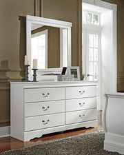Ashley Furniture Anarasia dresser and mirror set showing a wooden dresser with a matching mirror in a modern bedroom setting.