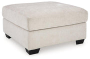 Ashley Furniture Aviemore oversized accent ottoman with plush fabric and sturdy wooden legs, ideal as a stylish footrest or additional seating.