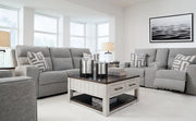 Ashley Biscoe living room set with sofa and armchair, featuring plush cushions and modern design for comfortable home seating.