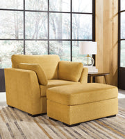 Ashley Furniture Keerwick living room set with sofa and loveseat in neutral fabric, modern design, and plush cushions.
