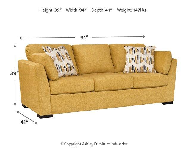 Ashley Furniture Keerwick living room set with sofa and armchair, featuring plush cushions and neutral upholstery.