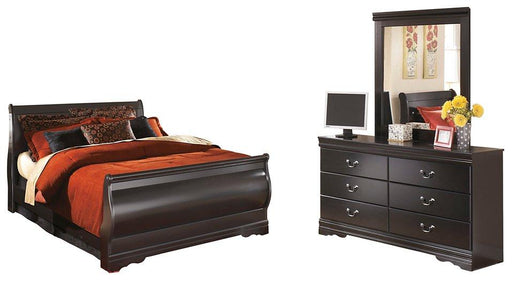 Ashley Furniture Huey Vineyard bedroom set featuring a bed, dresser, and nightstands in a warm, rustic style for a cozy bedroom.