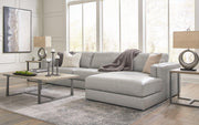 Ashley Furniture Amiata sectional with chaise showing plush fabric, modern design, and spacious seating in a contemporary living room setting.