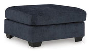 Ashley Furniture Aviemore oversized accent ottoman with plush fabric and sturdy wooden legs, ideal for living room decor.