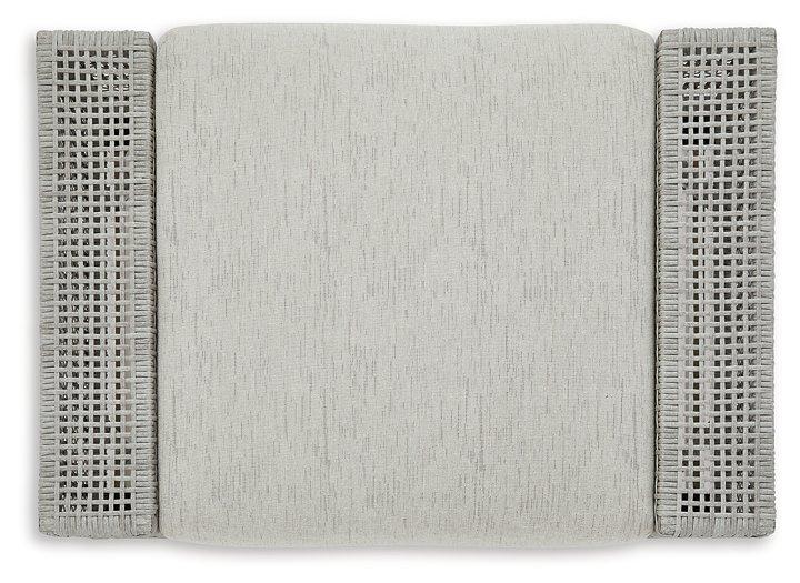 Ashley Furniture Seton Creek outdoor seating set with cushioned chairs and table, perfect for patio relaxation and outdoor dining.