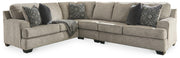 Ashley Furniture Bovarian living room set with sofa, loveseat, and armchair, featuring beige upholstery and wooden accents.