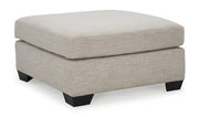 Ashley Furniture Mahoney living room set featuring a sofa and loveseat with plush upholstery and wooden accents.