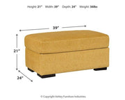 Ashley Furniture Keerwick living room set featuring a sofa and armchair with neutral upholstery and wooden legs.