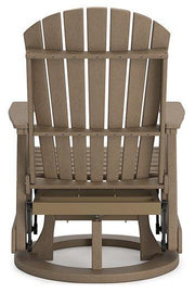 Ashley Furniture Hyland Wave outdoor swivel glider chair for outdoor dining, featuring a contemporary design with cushioning.