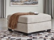 Ashley Furniture Mahoney living room set with sofa and armchair, featuring neutral fabric and modern design.