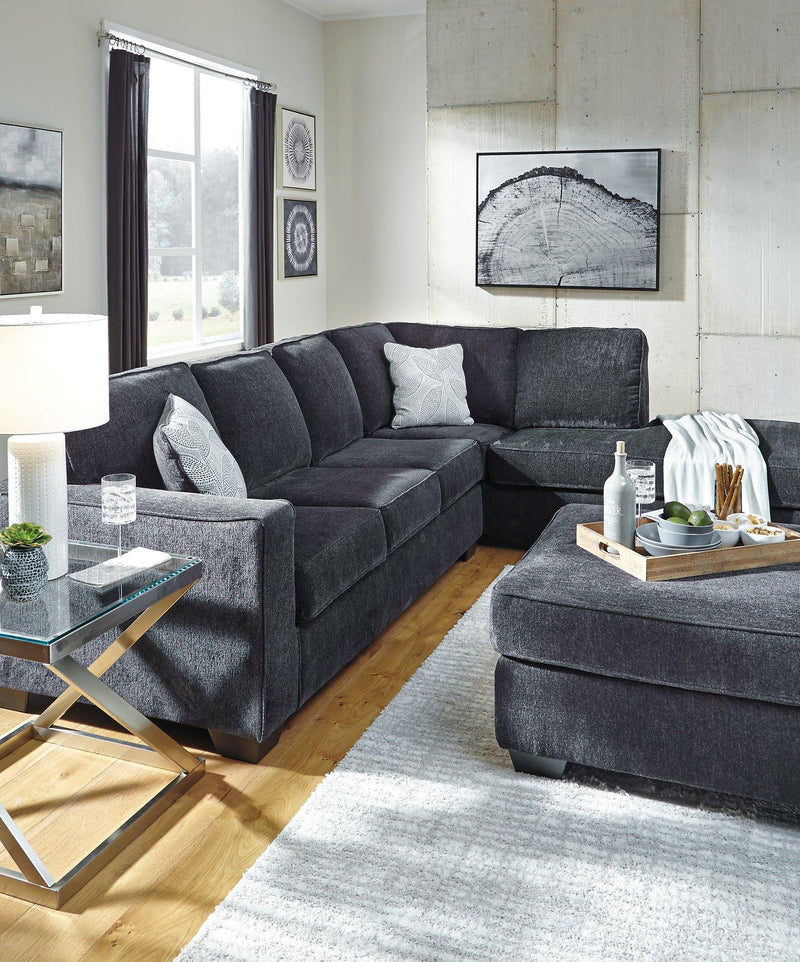 Ashley Furniture Altari living room set with sofa, loveseat, and coffee table arranged in a contemporary living space.