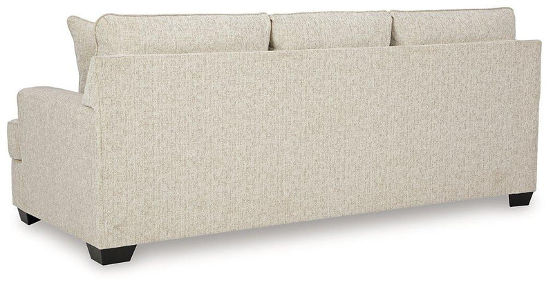 Ashley Furniture Heartcort Living Room Set featuring a plush sofa and matching armchair in a modern living room setting.