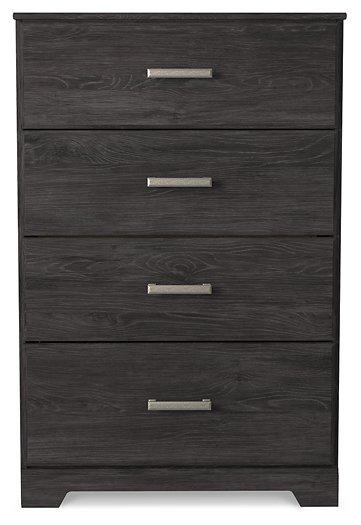 Ashley Furniture Belachime chest of drawers with multiple drawers and wood finish, showcasing a stylish bedroom storage solution.