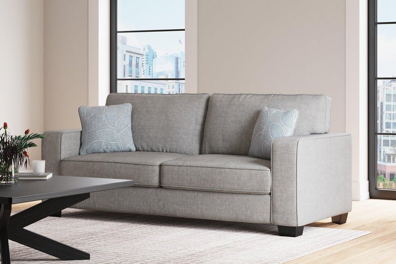 Ashley Furniture Altari living room set with sofa and armchair in a modern, stylish design, shown in a cozy living space.