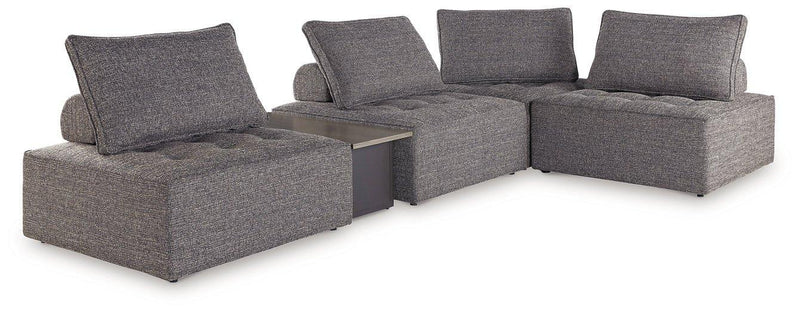 Outdoor sectional sofa from Ashley Furniture's Bree Zee collection, featuring cushioned outdoor seating with neutral tones.