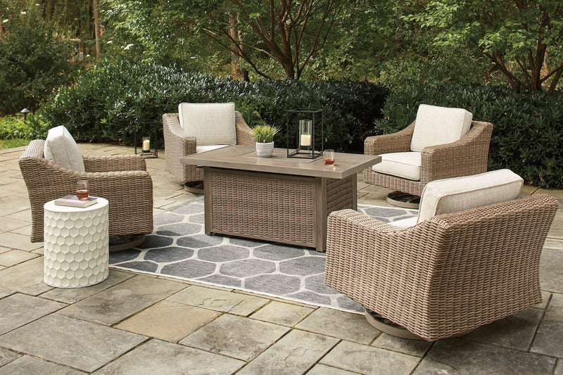 Outdoor seating set with Ashley Furniture Beachcroft fire pit table and four Nuvella swivel lounge chairs on a patio.