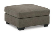 Ashley Furniture Mahoney living room set with sofa and armchair in a modern design, featuring neutral upholstery and wooden accents.
