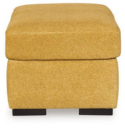 Ashley Furniture Keerwick living room set featuring a sofa and armchair with neutral upholstery and modern design.