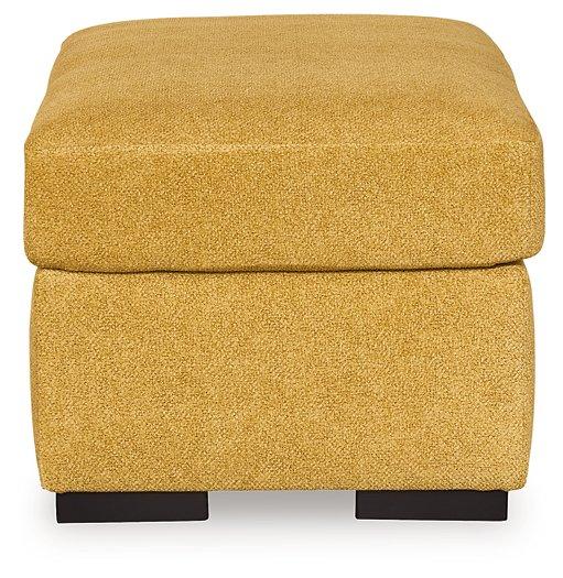 Ashley Furniture Keerwick living room set featuring a sofa and armchair with neutral upholstery and modern design.