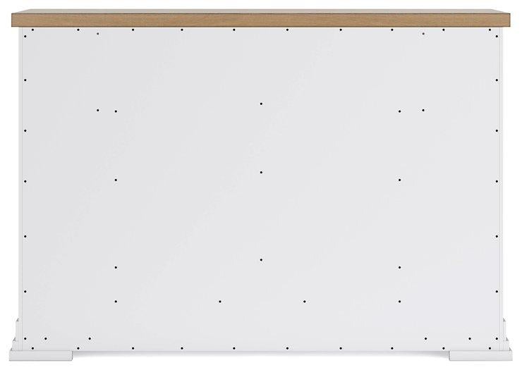 Ashbryn dresser by Ashley Furniture featuring a modern design with multiple drawers and a dark wood finish.