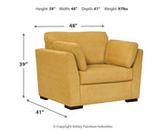 Ashley Furniture Keerwick Living Room Set with sofa and armchair in a cozy, modern living room setting