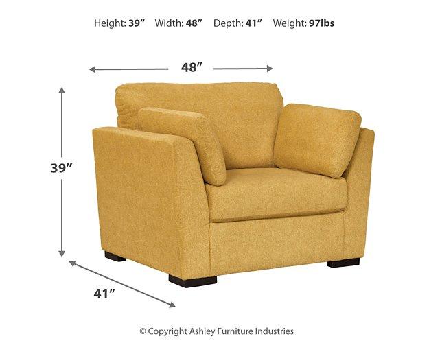 Ashley Furniture Keerwick Living Room Set with sofa and armchair in a cozy, modern living room setting