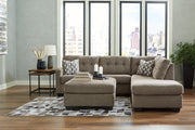 Ashley Furniture Mahoney living room set with sofa and armchair in a modern design, featuring neutral upholstery and plush cushions.