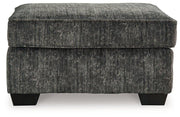 Ashley Furniture Lonoke living room set with sofa, loveseat, and armchair arranged in a modern, cozy living space.