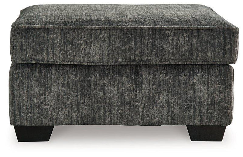 Ashley Furniture Lonoke living room set with sofa, loveseat, and armchair arranged in a modern, cozy living space.