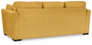 Ashley Furniture Keerwick Living Room Set featuring a sofa and armchair with plush upholstery and modern design.