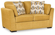 Ashley Furniture Keerwick living room set featuring a sofa and loveseat with neutral upholstery and modern design.