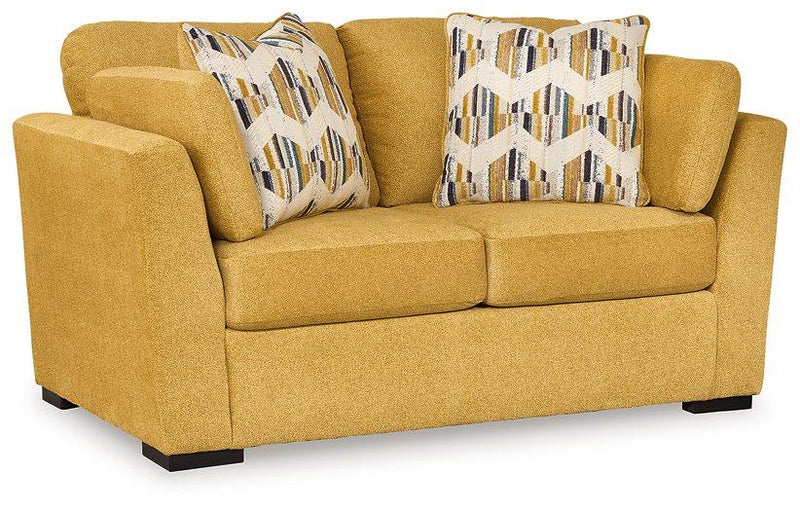 Ashley Furniture Keerwick living room set featuring a sofa and loveseat with neutral upholstery and modern design.