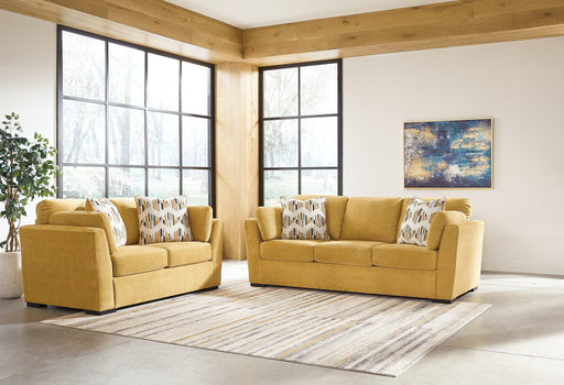 Ashley Furniture Keerwick living room set with a sofa and loveseat featuring plush cushions and neutral upholstery.