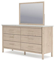 Ashley Furniture Cadmori dresser and mirror set, featuring a modern wooden dresser with a matching mirror for bedroom storage.