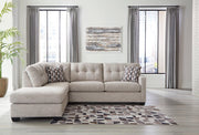 Ashley Mahoney living room set with a sofa and armchair featuring neutral upholstery and modern design.