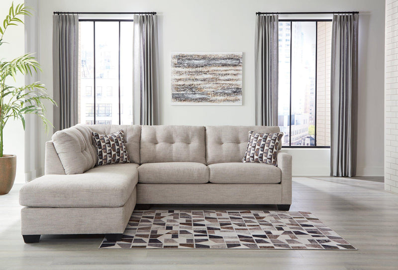 Ashley Mahoney living room set with a sofa and armchair featuring neutral upholstery and modern design.