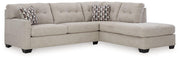 Ashley Mahoney living room set with sofa and armchair, featuring neutral upholstery and contemporary design.