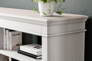 Ashley Furniture Kanwyn Credenza curio with glass doors and wooden shelves, showcasing elegant storage and display space.